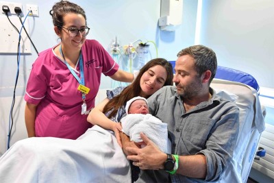 Parents with midwife in maternity unit.jpg